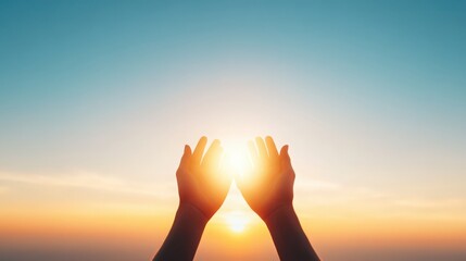 Two hands reaching up towards the sun