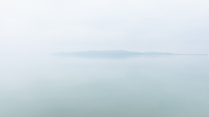 Huge fog at the lake Balaton on a winter day.
