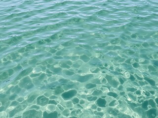 Obraz premium Ripples and waves in a body of water create a mesmerizing texture, reflection, serene