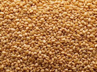 Fototapeta premium Close-Up of Organic Whole Raw Sesame Seeds Isolated on a Clean Background, Captured from Above for Culinary and Health-Focused Imagery, Ideal for Stock Photo Use