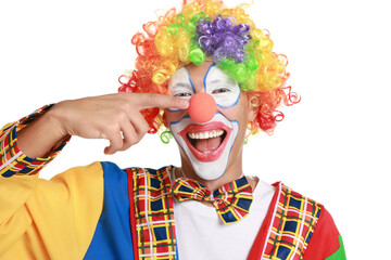 Portrait of happy clown pointing at his nose on white background