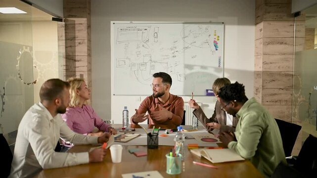 Marketing team discussing during brainstorming session in slow motion