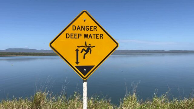 A warning danger deep water sign in lake Proserpine Queensland Australia 