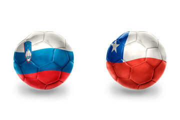 Fototapeta premium football balls with national flags of slovenia and chile ,soccer teams. on the white background.