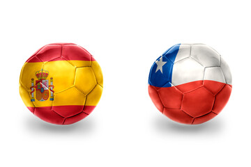 Fototapeta premium football balls with national flags of spain and chile ,soccer teams. on the white background.
