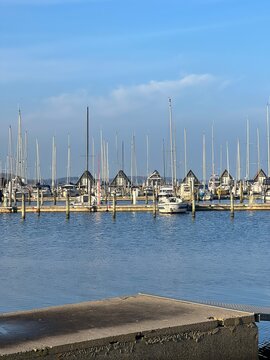 Skive yacht harbor in Skive, Denmark, Europe. Harbor with Wooden Pier and Sailing Ships. Beautiful view. Boats moored in Maarup Havn, Samsoe, Jutland, Denmark. Beauty in nature. Sailboats in harbor