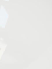 Close-up shot of a shiny gloss texture surface, reflecting light and creating a sleek and modern look, sheen, color