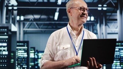 Seasoned computer scientist expertly managing data while navigating in industrial server room....