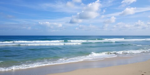 Fototapeta premium Beautiful cloudscape over the sea and beach, waves crashing on the sand, shore, tranquil
