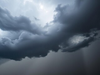 Obraz premium Dark, ominous sky filled with thick, billowing black clouds before a thunderstorm, clouds, stormy
