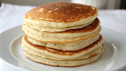 Closeup view of a stack of fluffy buttermilk pancakes, breakfast, food, delicious, fluffy, sweet, homemade, tasty, brunch