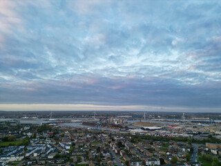 Fototapeta premium High Angle View of Tilbury City Centre and Docks on River Thames, borough of Thurrock, Essex, England, United Kingdom. Aerial View Was Captured with Drone's Camera on April 20th, 2024 at Just After Su