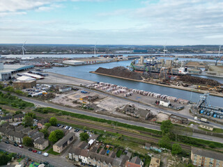 Fototapeta premium High Angle View of Tilbury City Centre and Docks on River Thames, borough of Thurrock, Essex, England, United Kingdom. Aerial View Was Captured with Drone's Camera on April 20th, 2024 at Just After Su
