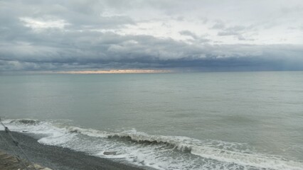 The sea in bad weather. Sea shore, surf, pebbles.