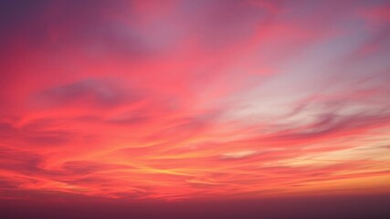 Obraz premium Vibrant red sunset or sunrise over wide-format sky with multitude of shade colors, vibrant, red