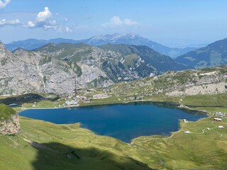 The alpine lake Melchsee or Melch Lake in the Uri Alps mountain massif, Kerns - Canton of Obwald, Switzerland (Kanton Obwalden, Schweiz)