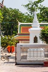 Two monks and a bicycle, Wat Ratchanadda, Bangkok, Thailand