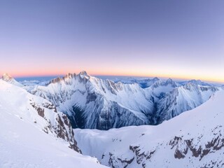 Fototapeta premium Beautiful panoramic view of a rugged mountain range covered in snow during sunrise, snow, mountains