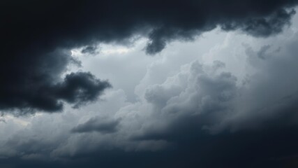 Obraz premium Dark and ominous storm clouds forming in the sky, creating a dramatic and foreboding atmosphere, forecast, atmosphere