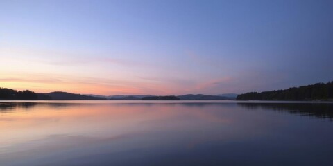Fototapeta premium A serene lake at dusk, reflecting the last colors of the sunset in the calm water, lake, dusk colors