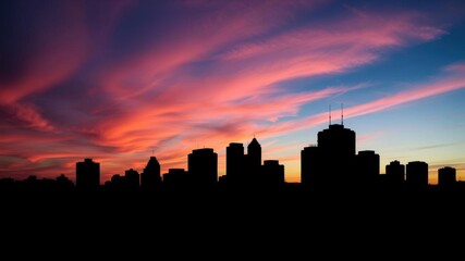 Dusk skyline with silhouetted buildings and colorful sky, dusk sky, landscape
