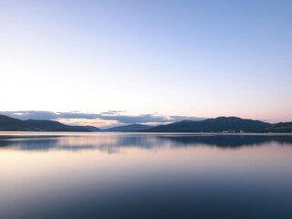 Obraz premium A serene image of a tranquil lake at dusk, reflecting the soft colors of the sky and surrounding landscape, lake, evening