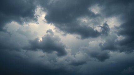 Obraz premium Dark and ominous storm clouds covering the sky, creating a dramatic and moody atmosphere, atmospheric, grey