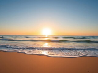 Obraz premium Beautiful sunrise over a tranquil beach with soft sand and gentle waves, picturesque, peaceful