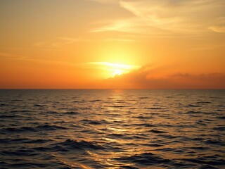 Fototapeta premium Vibrant sunrise over calm ocean waters, casting a warm golden glow, vibrant, sunset