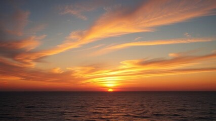 Obraz premium A beautiful sunrise over a calm ocean, with the sky painted in a spectrum of warm colors, seascape, remote