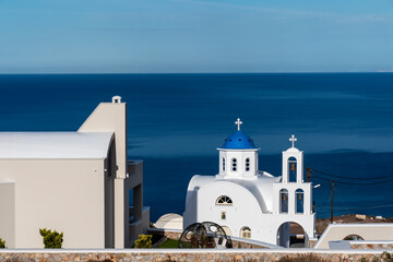Orthodox church of Santorini with the dome painted an intense blue which makes it fascinating and typical of the island.