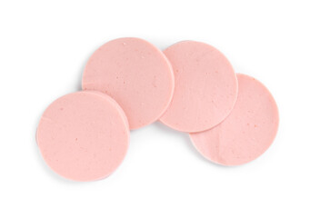 Obraz premium Slices of tasty boiled sausage isolated on white, top view