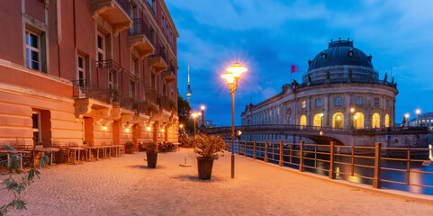 View of the famous Museum Island and the Spree River in Berlin at night.