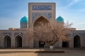 The main entrance and courtyard of the Kalyan Mosque - the main Friday mosque of Bukhara on a sunny...