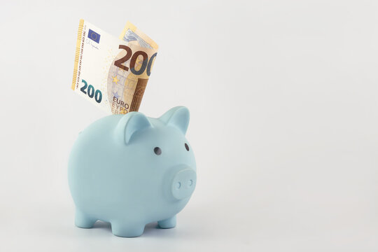 Blue piggy bank and 200 euro note