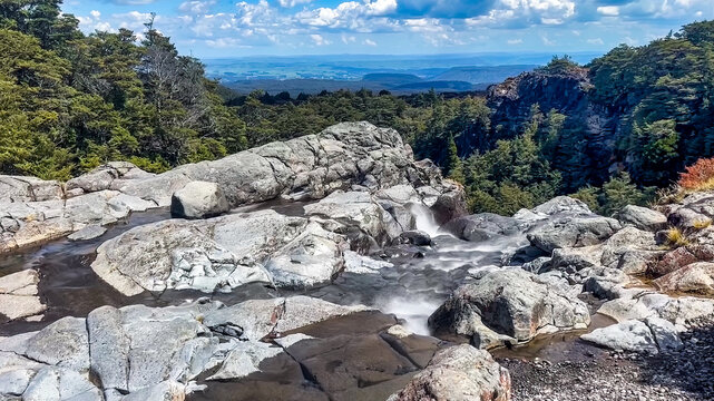 The river flow of water is about to be a waterfall cascade over the the Mangawhero Falls walk, Turoa Ski field in the Tongariro National Park