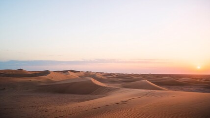 Sunset over the sand desert.