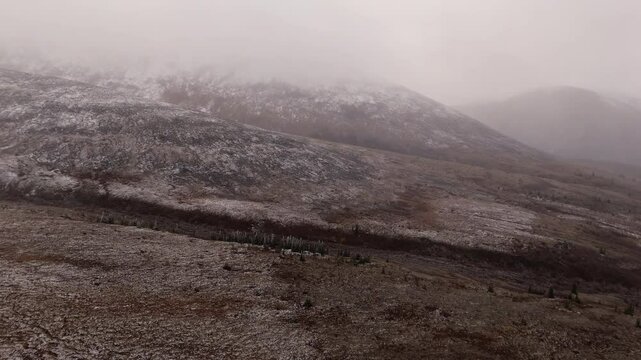 Atmospheric Mountain Range Of Ogilvie In The Yukon Territory Of Northwestern Canada. Aerial Drone Shot