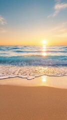 Obraz premium Softly glowing blue ocean wave at sunset on fine sandy beach, sunset on beach, soft focus, serene coastal scene