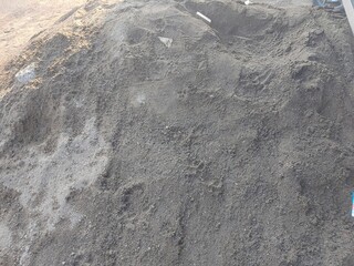Close up of sand construction on the ground at sunny day 