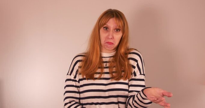Beautiful girl dramatizing not knowing in different ways, medium closeup
