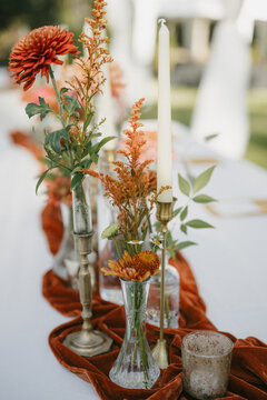 Romantic Backyard Wedding Table with Candles and Fall-Inspired Flowers