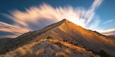 Fototapeta premium Clouds in motion Craggy mountain top Time-lapse of cl