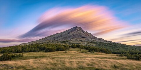 Fast-moving streaks Alpine peak Time-lapse of clouds 