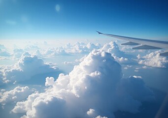 Fototapeta premium Breathtaking view from an airplane wing soaring above fluffy white clouds