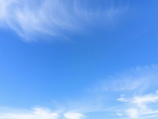 Naklejka premium High-altitude blue sky with wispy clouds, gentle cloud formation, atmospheric conditions, natural scenery
