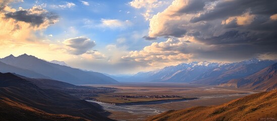 Fototapeta premium Majestic landscape view from Thiksey Monastery showcasing mountains valleys and dramatic sky in the serene beauty of Ladakh region
