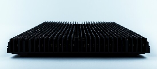 Computer memory module with metal heat spreader on a white background showcasing modern design and technological features in computing systems