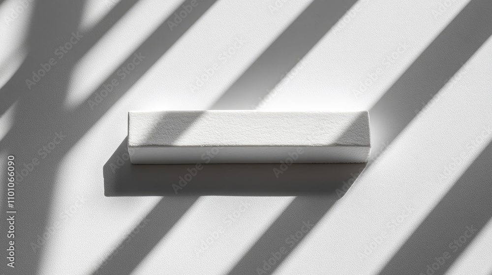 Poster Whiteboard eraser on a clean surface with shadows creating a modern minimalist aesthetic for background or object concept designs