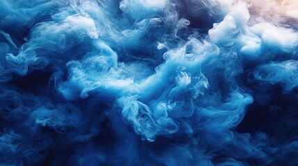 Obraz premium Blue ink swirling in water creating abstract patterns and textures with vibrant hues and fluid motion. Ideal for artistic backgrounds and designs.